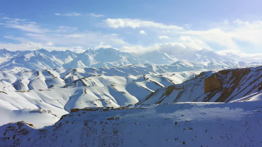 The mountain range is covered in snow