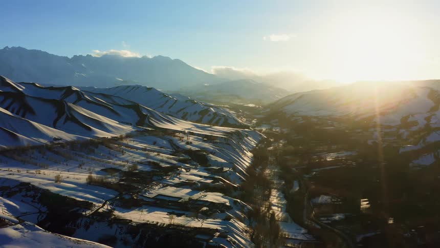 The mountain range is covered with snow