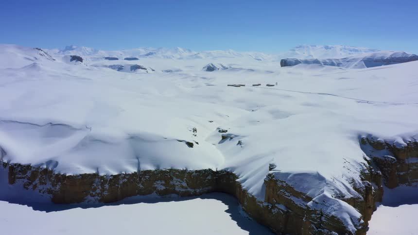 An aerial view of an arctic area is displayed