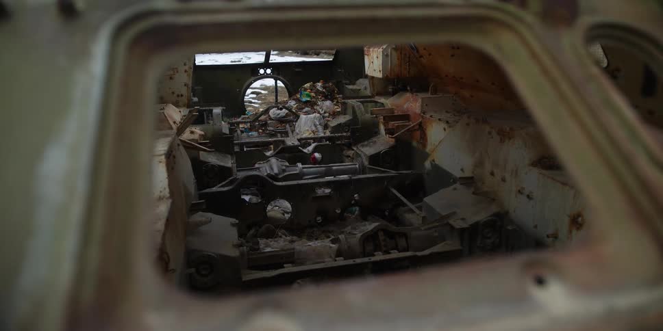 Interior of abandoned metal structure full of equipment