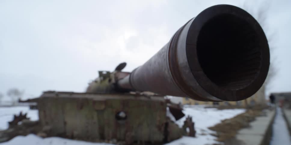Abandoned old tank sitting outdoors in snow