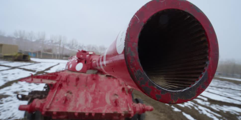 A military tank sitting in a field