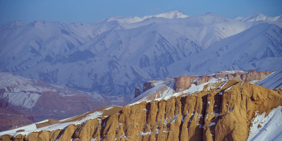 Snow covered mountains on a winter day