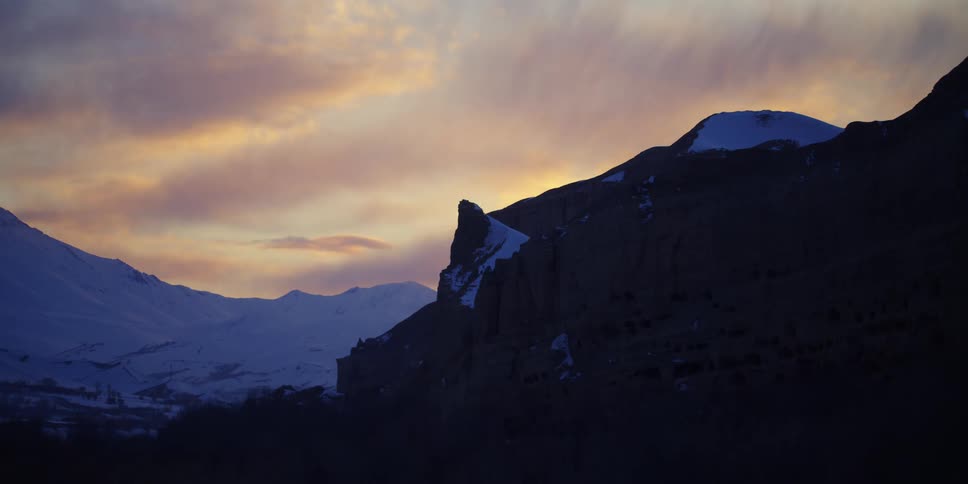 Snow covered mountains at dusk