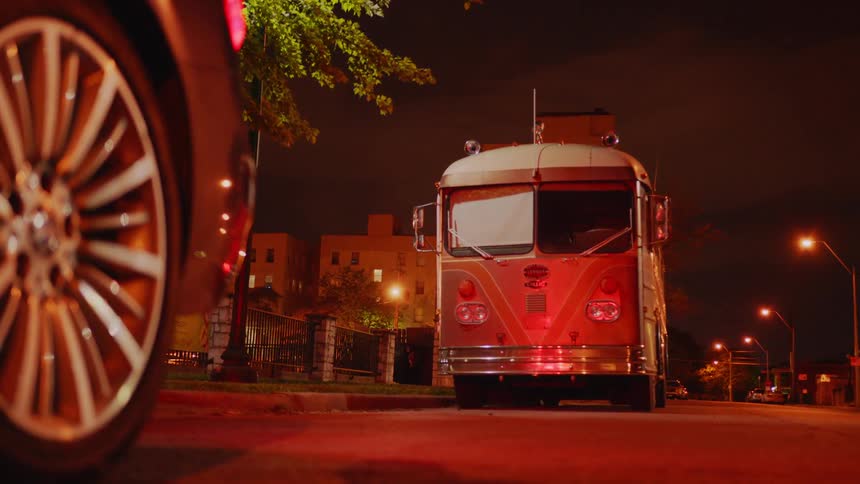 Vehicles parked on a street at night