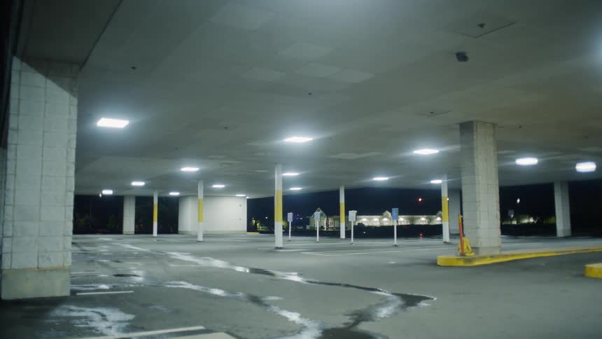 The parking garage is empty at night