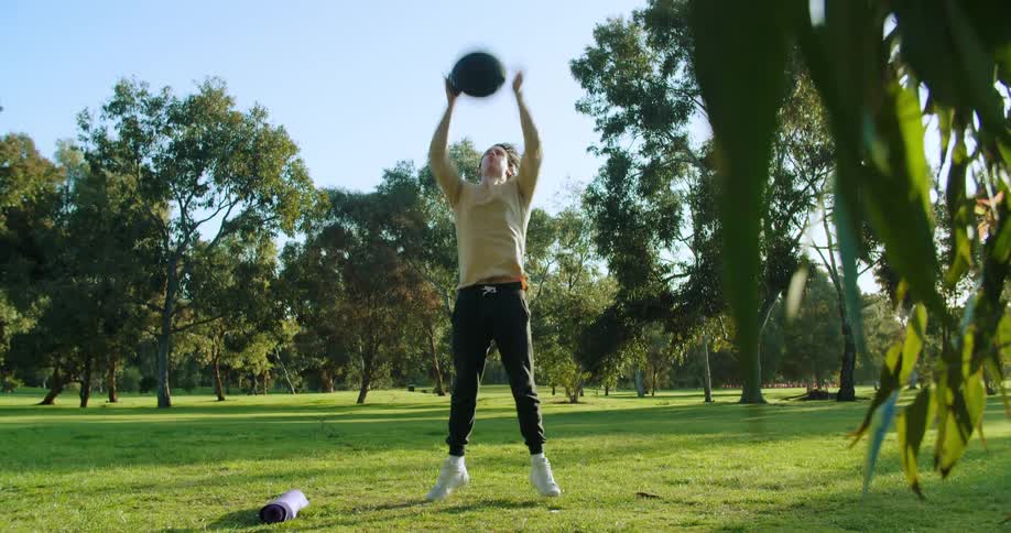 A man is exercising outdoors in spring