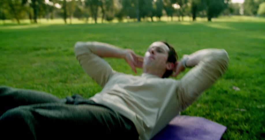 A man is exercising outdoors in spring