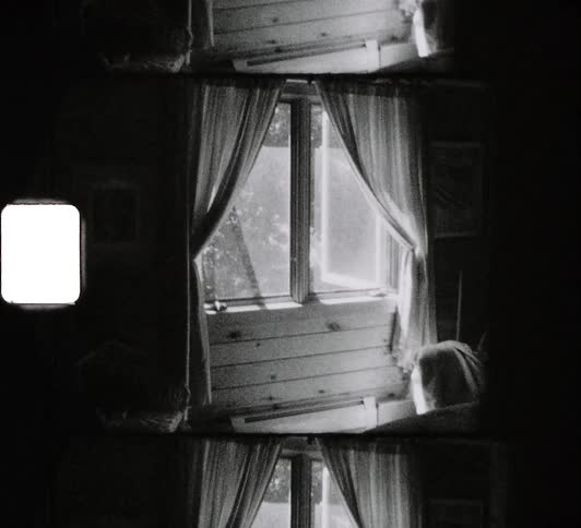 Sunlight shines through the window in a bedroom during the day