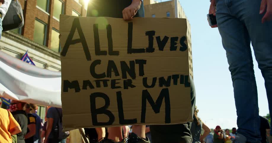 People holding signs at a protest