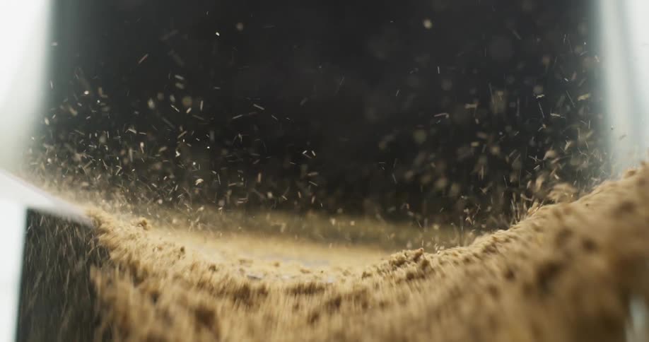 Sand flying down a chute
