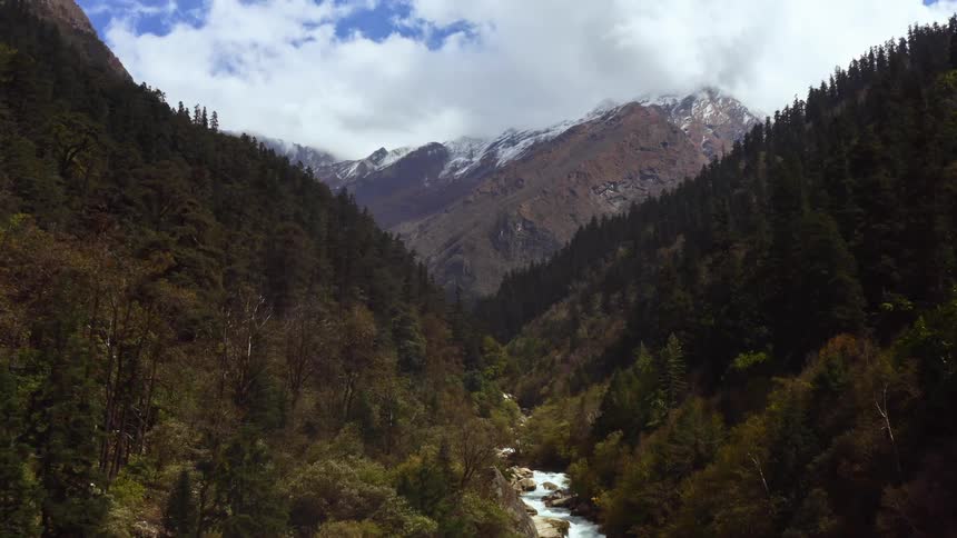 A valley in the mountains near the bright blue sky