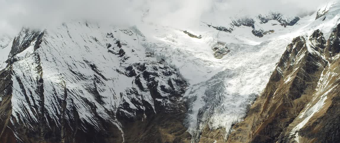 Snow covered mountains are displayed