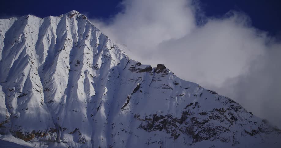 Aerial view of mountains in winter is displayed