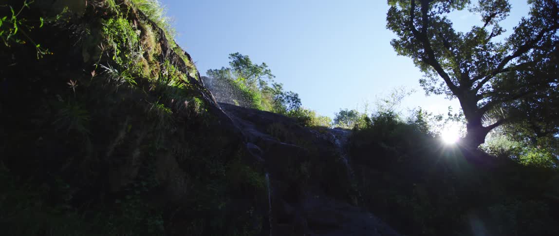 A water fall running over a cliff