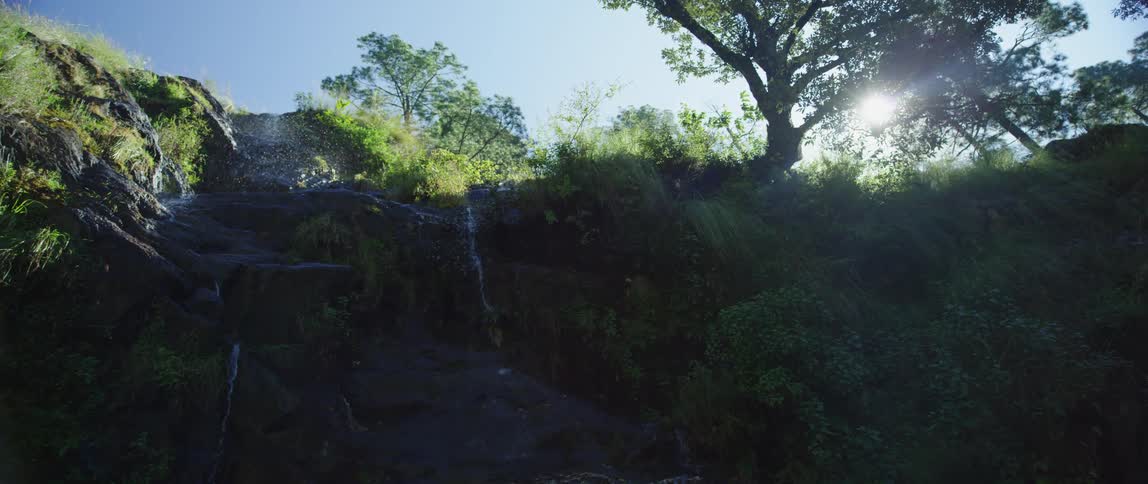 The water pours off the mountain