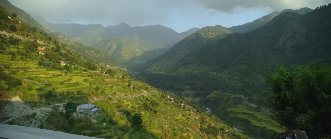 Aerial view of rolling hills with a river in the valley