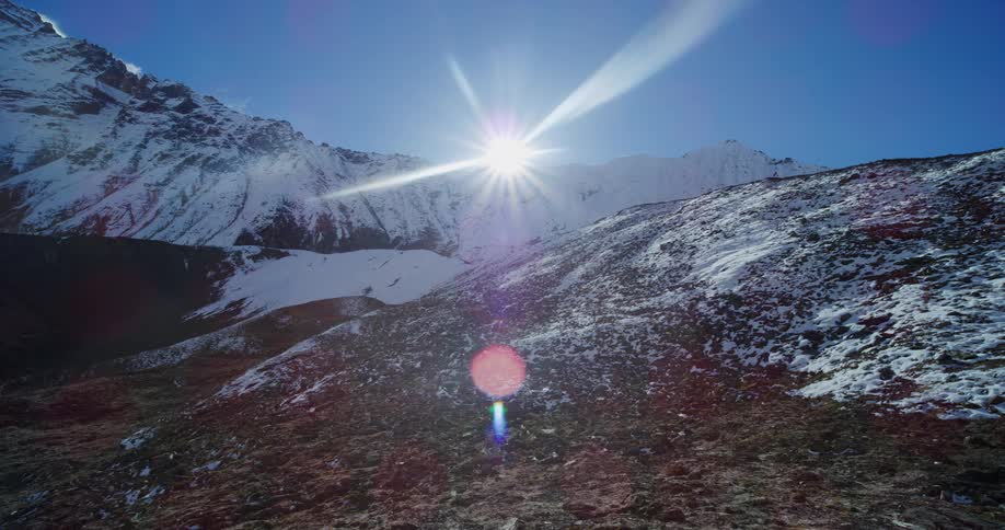 A snowy slope on a mountain under the sunshine