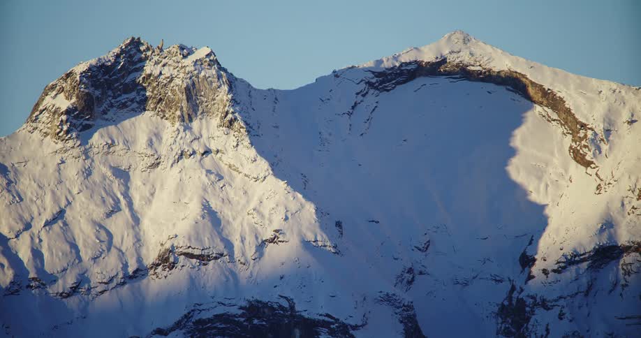 A mountain top covered in snow