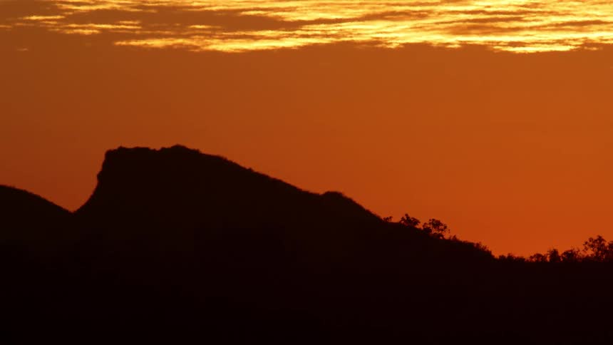 A sunset on a small mountain top
