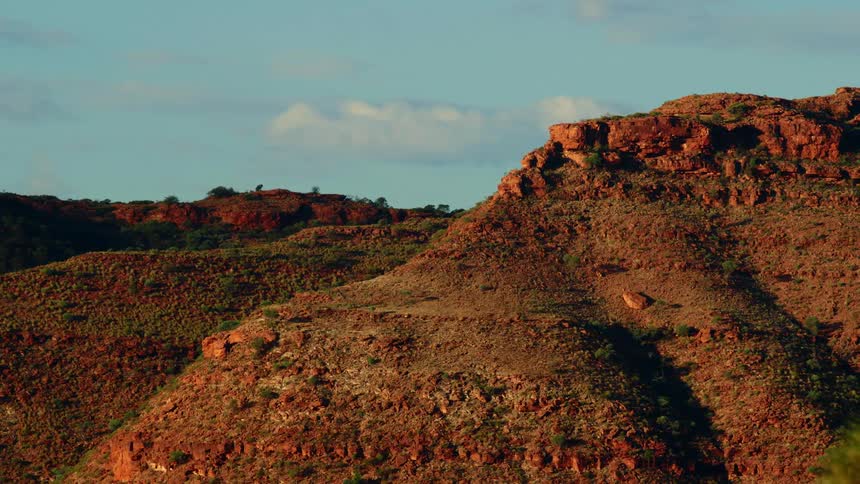 Aerial view of a landscape at dusk is displayed