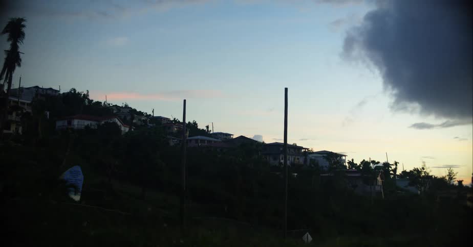 A small town on a hillside during the day