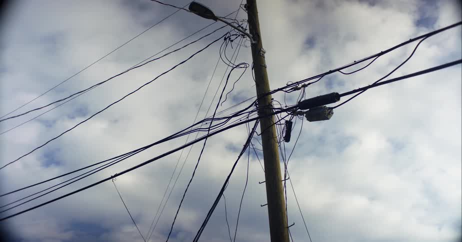 The top of a utility pole during the day