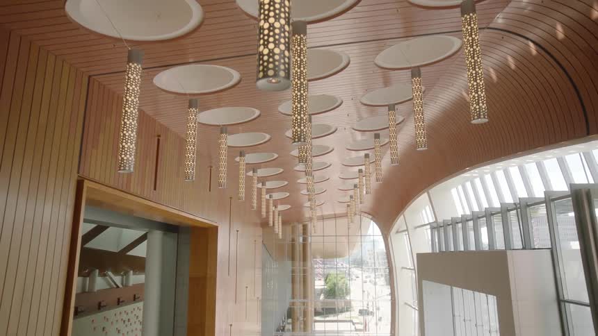A reception area has lamps hanging from the ceiling