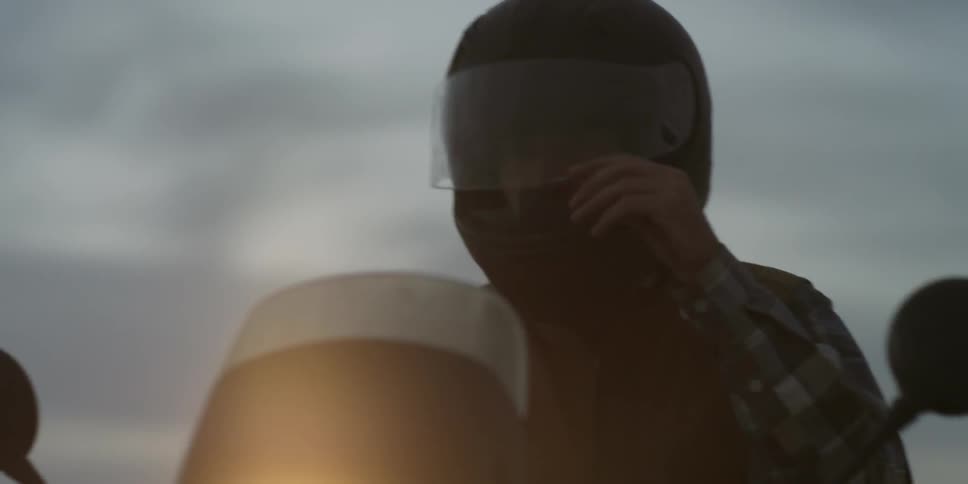 A person rides a motorcycle