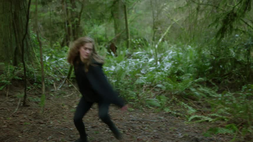 A female dancing in the forest