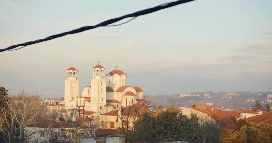 Large white church with domed rooftop and belltowers