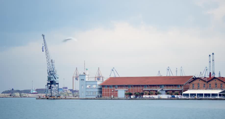 A construction crane on the shore