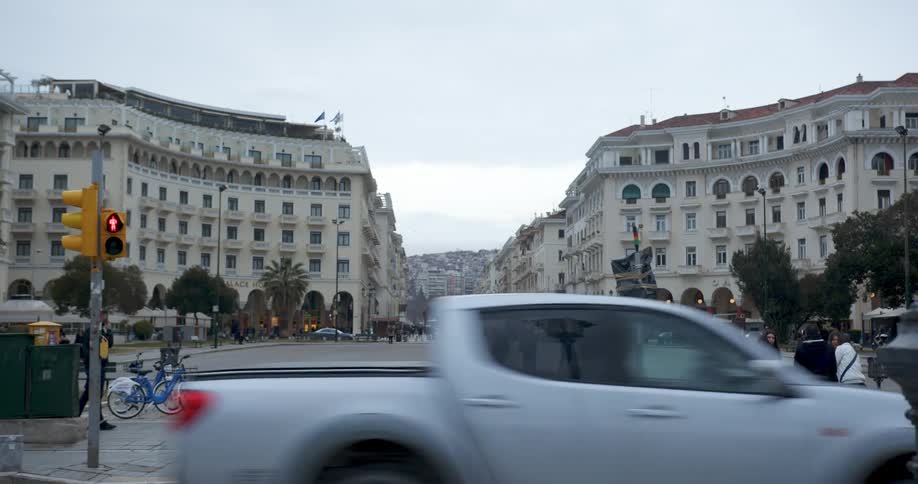 Pedestrian relax in a plaza surrounded by rounded in a metropolis on a cloudy day