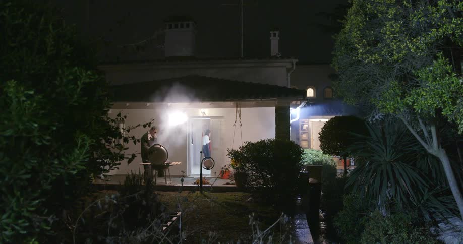 A man is cooking on a grill