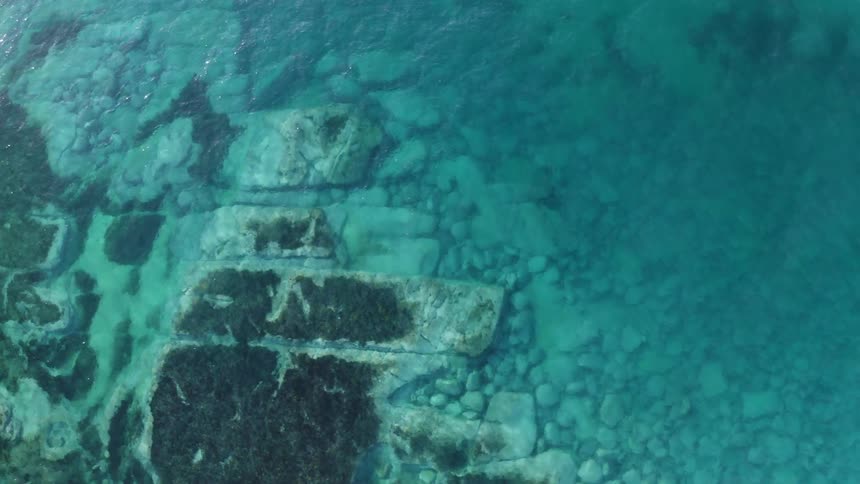 Aerial view of ocean water is displayed