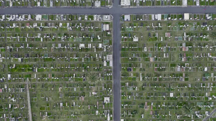 A birds eye view of rows of houses in a neighborhood