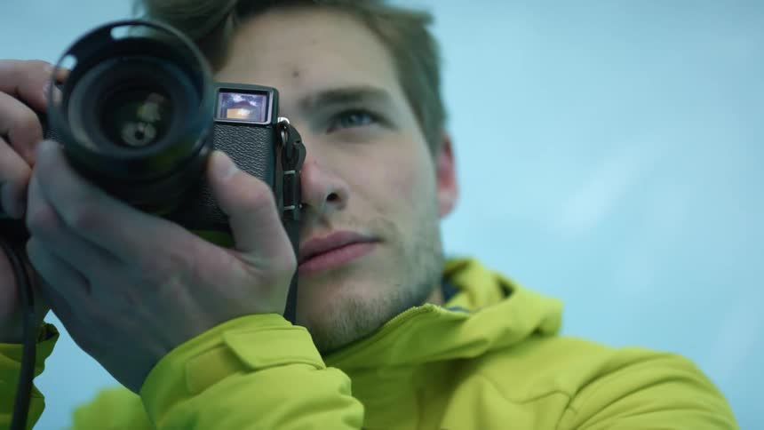 A man is taking a photograph