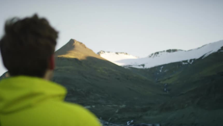 A man is hiking outdoors during winter
