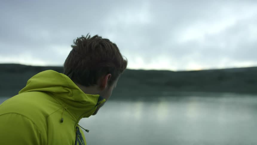 A man is traveling in a boat on the lake
