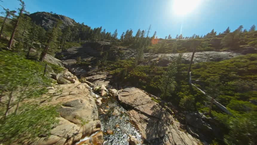 A small stream runs through the mountain range