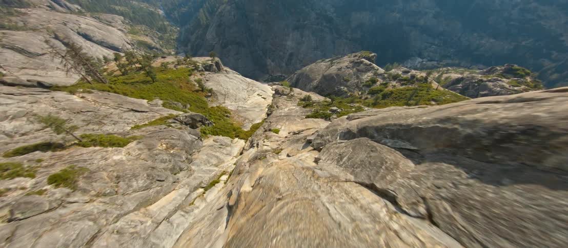 The steep mountain leads down to the cavern below