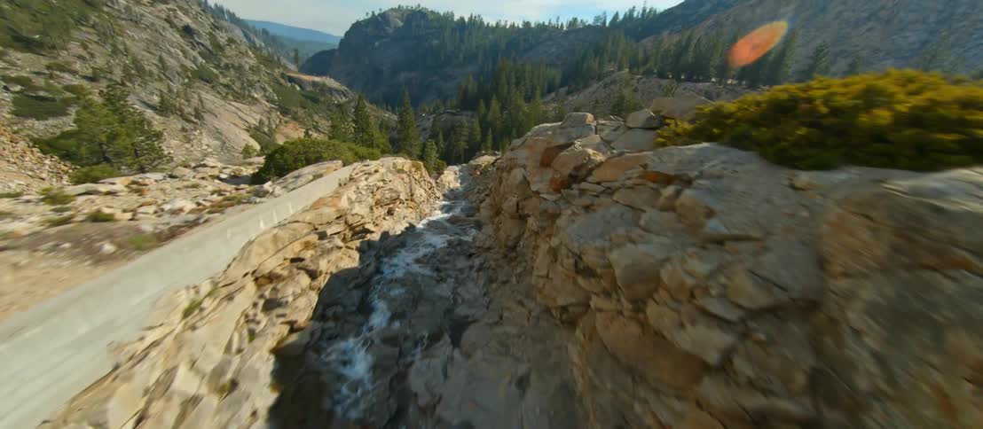 The stream runs through the mountains