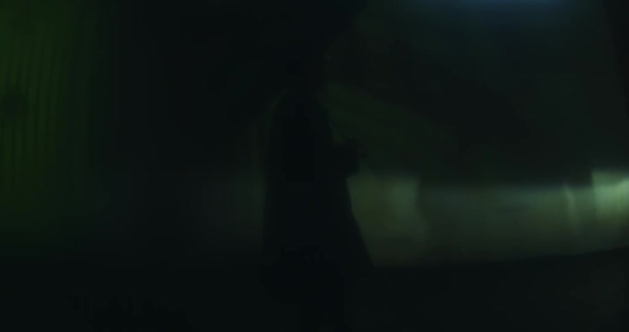 Person moves after shadows flow through light beam