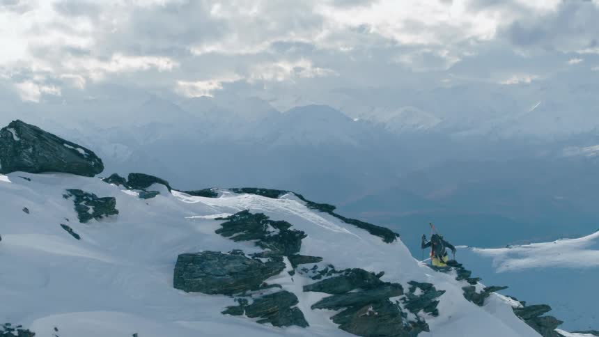 A man is hiking up the mountain