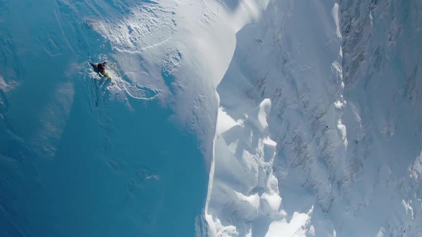 A person is standing outdoors in an arctic area