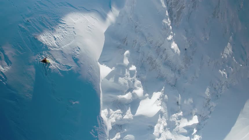 A snow covered mountain in the wilderness on a winter day