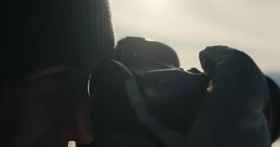 A woman taking pictures outside