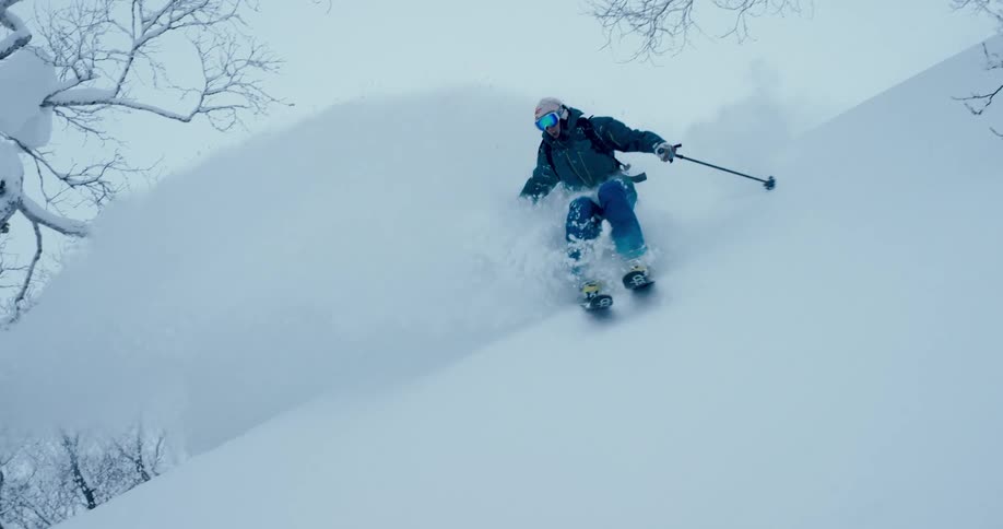 A man skiing down a mountain