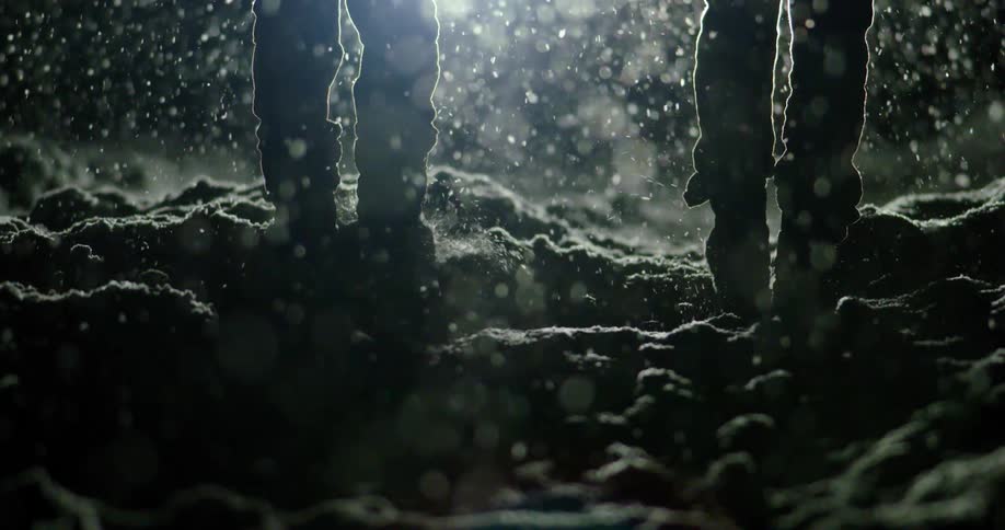 People are walking in snow at night