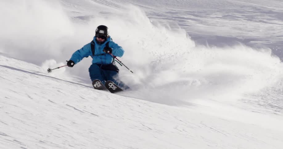 Man downhill skiing in snow